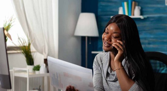 optimized-flipped_businesswoman-talking-on-phone-call-and-looking-at-2021-12-09-22-29-27-utc